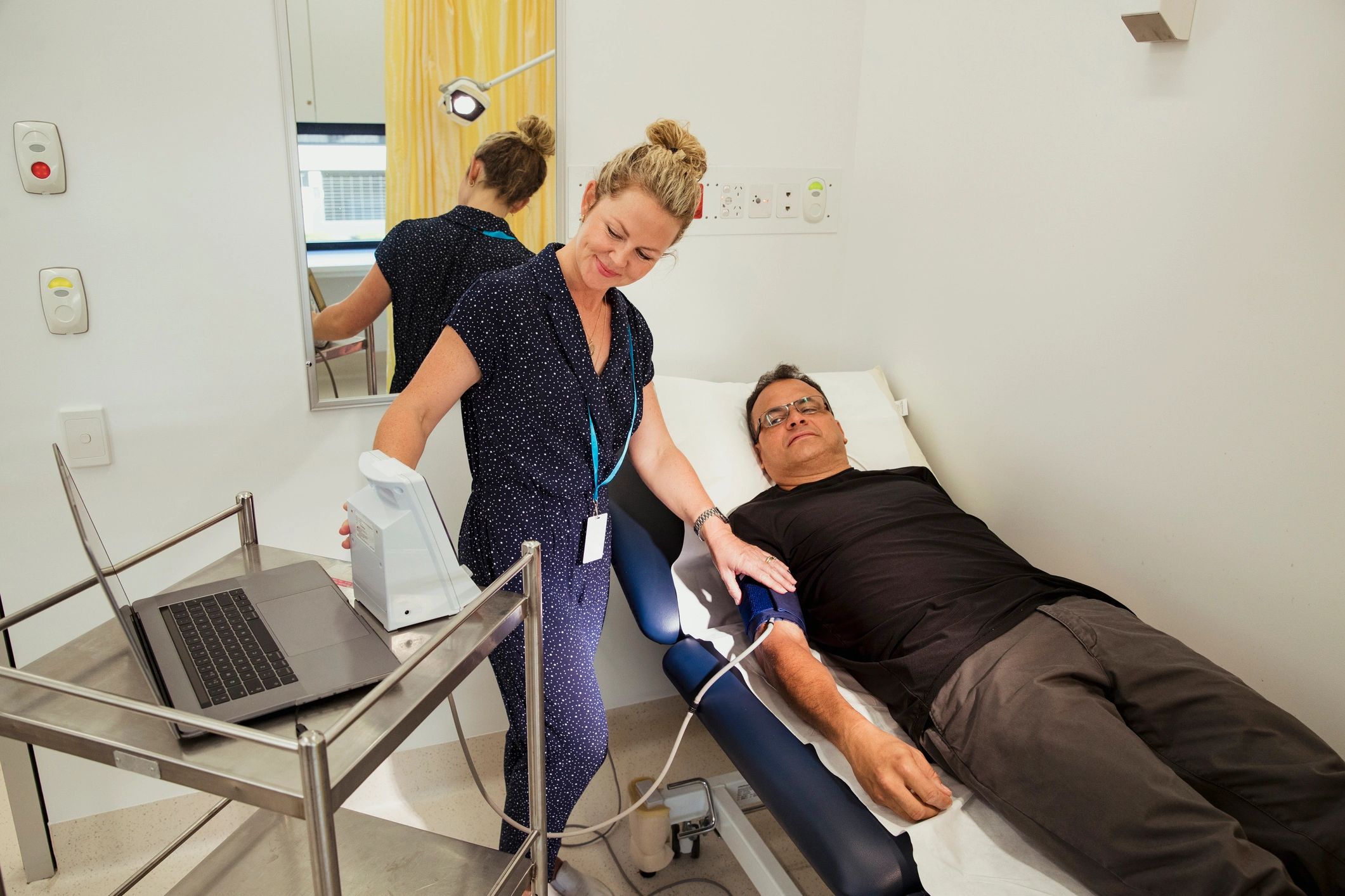 Nurse checking a patient's blood pressure