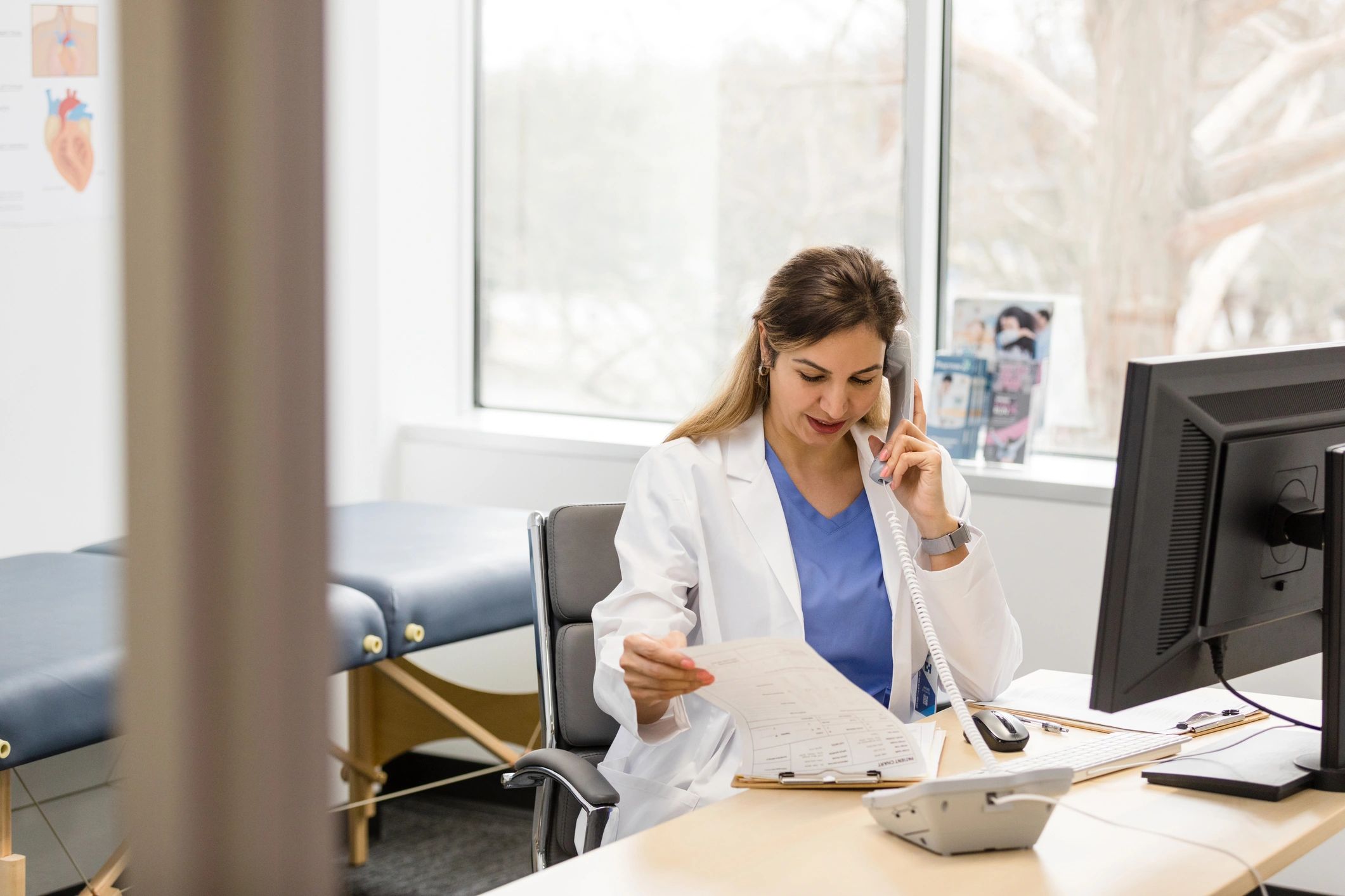 Healthcare professional speaking on the phone in an office