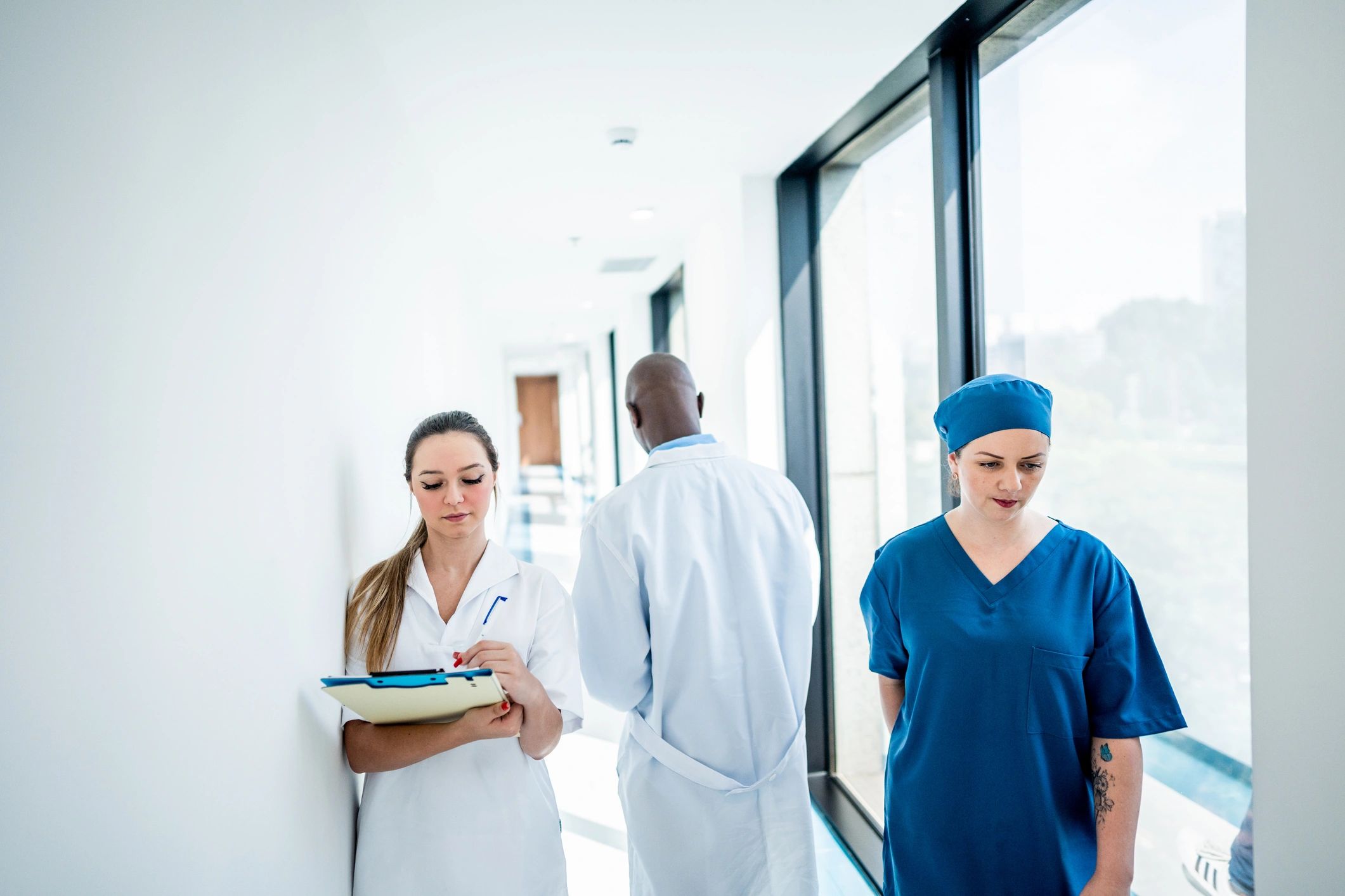 Doctors and nurse walking through a hospital corridor