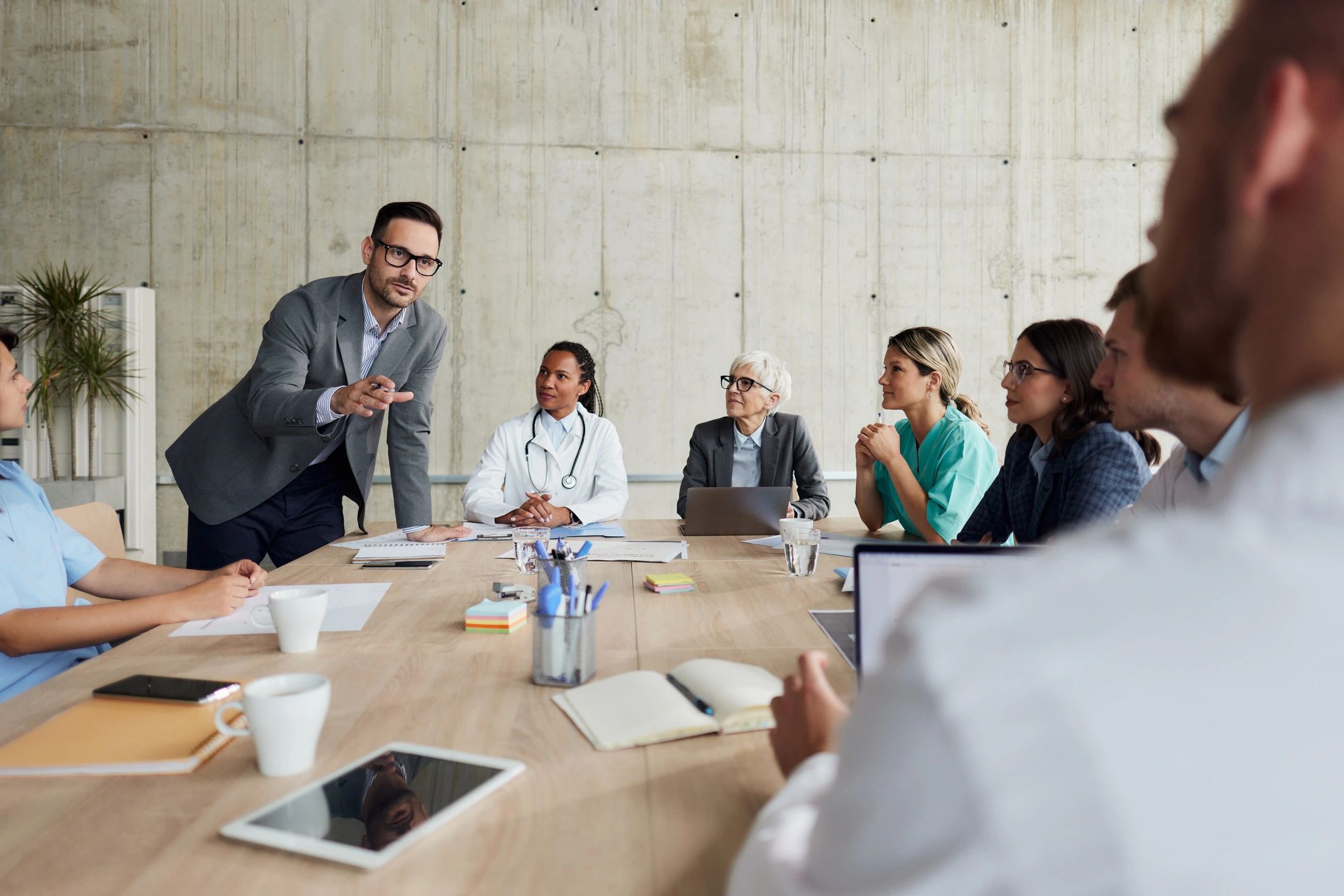 Healthcare team collaborating in a hospital meeting room