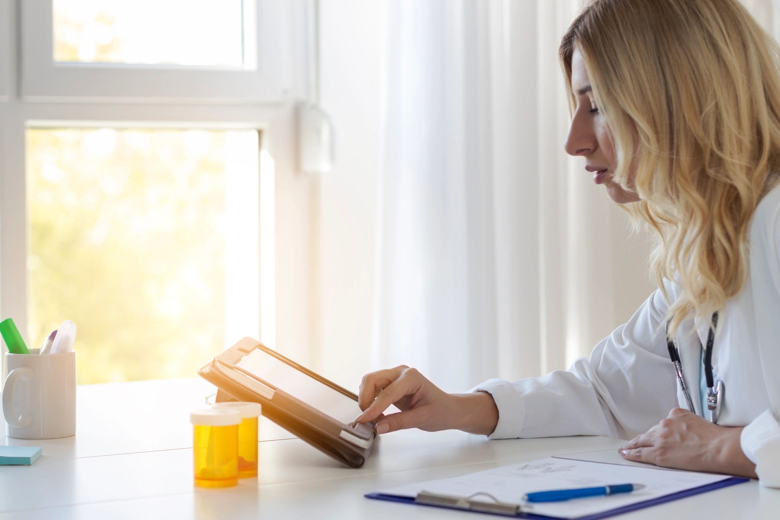 Clinician using a tablet for clinical documentation